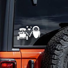 a sticker on the back of an orange jeep