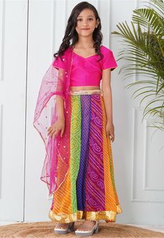 Readymade Faux Georgette Lehenga in Multicolor This attire with Shantoon Lining is Enhanced with Fancy Tassels, Bandhej, Leheriya Print, Mirror, Zari Work In Belt, Gota Lace in Lehenga Drawstrings with Beautiful Dupatta Enhanced with Sequinned Buties and Gota Lace Available with a Art Silk Pink Choli Crafted in V Neck and Short Sleeves and a Net Dupatta in Pink Do Note: Accessories shown in the image are for presentation purposes only. (Slight variation in actual color vs. image is possible). Bollywood Style Festive Multicolor Sets, Bollywood Style Multicolor Festive Sets, Bollywood Style Multicolor Sets With Sheer Dupatta, Festive Multicolor Palazzo Set For Party, Multicolor Zari Work Palazzo Set For Party, Multicolor Saree Set With Sheer Dupatta, Multicolor Sharara For Party, Multicolor Sets With Sheer Dupatta For Diwali, Multicolor Choli With Traditional Drape For Party