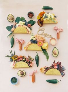 an assortment of food items arranged in the shape of tacos and avocados