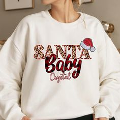 Stay cozy and festive with this personalized sweatshirt featuring a 'santa baby' design. Perfect for those colder months and adding a touch of holiday cheer to your wardrobe. Ideal for anyone looking for a comfy and classic piece for the holiday season. Product features - Knit in one piece without side seams for reduced fabric waste - Ribbed knit collar with seam for elasticity and shape retention - Made with a medium-heavy fabric blend of 50% cotton and 50% polyester - Classic fit and crew neck Winter Apparel, Clothing Winter, Fabric Waste, Christmas Jumper, Santa Baby, Baby Design, Custom Christmas, Festival Outfits, Holiday Cheer