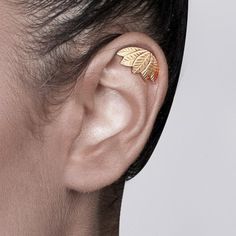 "If you're looking for a unique bohemian woodland helix earring, this is it! It is a single 14k gold cartilage stud earring in the shape of five leaves. This earring has an elegant matte finish. You receive one earring and it fits both ears. It is held by a hole on the top of the ear and comes with a gold ear backing. I have added the last picture with the place of the piercing colored in black that fits the earring. You can choose 14k yellow or white gold when you order. The white gold will be Gold Cartilage Earring, Gold Cartilage Earrings, Earring Cartilage, Elven Jewelry, Cartilage Earrings Stud, Helix Earring, Ear Piercings Cartilage, Wrap Earrings, Coupon Design