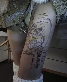 a woman with a tattoo on her leg