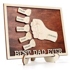 a wooden sign with the words best dad ever written on it and two thumbs pointing at each other