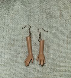 Upcycled Barbie arm earrings made into earrings. A great topic of conversation and a fun accent to any outfit. 3d Art Drawing, Doll Jewelry, Jewelry Earrings Dangle, Etsy Earrings, Dangle Drop Earrings, Etsy Accessories, Dangle Earrings, Accessory Gift, Jewelry Earrings