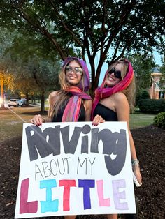 two girls holding a sign that says raviing about my little sister