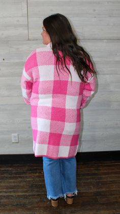 A pink long cardigan with a checkered design on it. This will keep you warm in the up-coming fall/ winter season. Fit: true to size Small: 2-4 Medium: 6-8 Large: 10-12 Model: medium Laundry: wash on cold, hang to dry Pink Sweater For Fall Cold Weather, Pink Sweater For Cold Weather In Fall, Fall Gingham Outerwear With Long Sleeves, Pink Casual Cardigan For Cold Weather, Casual Pink Cardigan For Cold Weather, Pink Cardigan For Cold Weather In Spring, Cozy Pink Cardigan For Cold Weather, Cozy Pink Sweater Coat For Fall, Pink Long Cardigan