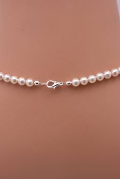 This lovely pearl necklace features ivory/cream Swarovski pearls (5 colors available) and sparkling rhinestone beads. A silver plated lobster clasp completes the necklace. Pearl available in white, ivory, light pink, light grey and dark grey. Comes in a gift box, perfect for gift giving. SIZING: Available in 16 inch, 18 inch or 20 inch. Necklaces will fit differently depending on the person so please measure carefully. Pearls used are 10mm (center), 8mm, and 6mm. Please feel free to check out th Pearl Wedding Necklace, Ivory Pearl Necklace, Pearl Necklace Wedding, Pearl Strand, Pearl Cream, Rhinestone Bridal, Ivory Pearl, Necklace Pearl, Pearl Strands