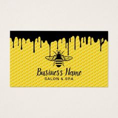 a yellow and black business card with a bee on the front, dripping from it