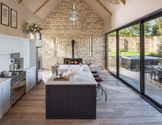 a large kitchen with an oven and dining area