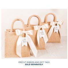 three jute bags with white ribbons tied around them and the words, precut ribbon and gift tags sold separately