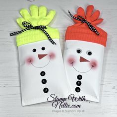 two bags with snowmen on them sitting next to each other