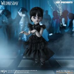 the doll is dressed in black and has dark hair