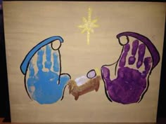 two handprints are shown on a piece of wood with a star above them