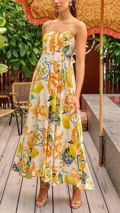 Embrace sunny elegance with our Citrus Charm Maxi, featuring a vibrant lemon print, sleek tie-back, and adjustable straps for the perfect fit. Casual Lemon Print Sundress For Beach, Summer Sundress With Lemon Print For Beach, Summer Lemon Print Sundress For Beach, Summer Sundress With Lemon Print, Summer Sundress With Lemon Print For Vacation, Summer Lemon Print Sundress For Vacation, Summer Style Sundress With Lemon Print For Vacation, Summer Beach Dress With Lemon Print, Beach Dresses With Lemon Print