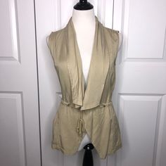 Sold Out At Francesca’s Online. New Francesca’s Trixxi Tan Vest Size Xs. Drawstring Around Back And Ties At Front. Says Olive Color But Actually More Tan. Two Pockets On Front. 100% Tencel! Retails For $48!!! See Pictures For Additional Details. If You Like Any Of My Other Items Let Me Know And We Can Bundle Them Together! Y Fitted Vest For Spring Day Out, Trendy Beige Vest For Spring, Fitted Vest For Day Out In Fall, Sleeveless Khaki Outerwear For Spring, Khaki Sleeveless Outerwear For Spring, Fitted Sleeveless Casual Outerwear, Fitted Khaki Outerwear For Day Out, Casual Fitted Sleeveless Outerwear, Spring Fitted Khaki Outerwear