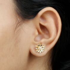 Product Details The Gold Petal Floral Stud Earring is a gorgeous piece of jewelry featuring a round cut diamond in a 6 prong setting. This elegant earring has a gold leaf design and a secure screw back closure. It makes a perfect gift for any woman who loves to accessorize with beautiful jewelry. The intricate design of the petals and leaves adds a touch of nature to these sophisticated stud earrings. With its high-quality materials and stunning design, the Gold Petal Floral Stud Earring is sure Diamond Flower Shaped Earrings With Brilliant Cut For Gifts, Gift Diamond Earrings With Brilliant Cut In Flower Shape, Diamond White Flower-shaped Diamond Earrings As Gift, Yellow Gold Round Flower Earrings For Anniversary, Yellow Gold Flower Earrings With Brilliant Cut, Diamond White Brilliant Cut Flower Earrings As Gift, Gold Flower Earrings With Brilliant Cut, Flower-shaped Cubic Zirconia Earrings With Diamond Cut, Brilliant Cut Flower Earrings For Gift