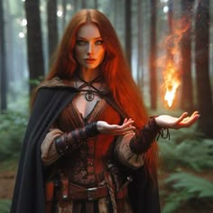 a woman with red hair is holding out her hand in the middle of a forest