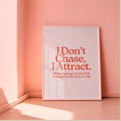 a white framed poster with the words i don't chase, i attract and what belongs its way to me