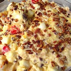 a casserole dish with nuts and cheese on it, ready to be eaten