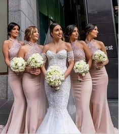 the bride and her bridesmaids are all wearing nude colored dresses