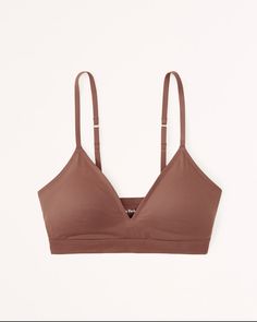 Our new super soft v-neck bralette in our no-show Next to Naked fabric you'll love. Features racerback detail, removable pads, bottom band detail and adjustable straps. Everyday No-show Seamless Bra, Everyday Seamless No-show Bra, Everyday Solid Bra With Adjustable Straps, Light Support No-show Bra, Everyday Seamless Triangle Top Bra, Everyday Fitted Soft Touch Bra, Soft Touch Fitted Everyday Bra, Women's Sleepwear, Sleepwear & Loungewear