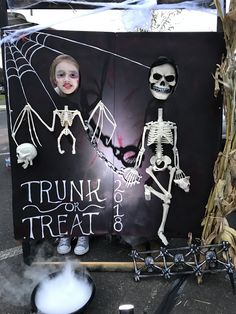 a halloween display with skeletons on it