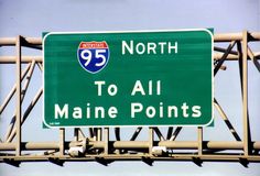 a highway sign that says north to all maine points on the side of a bridge