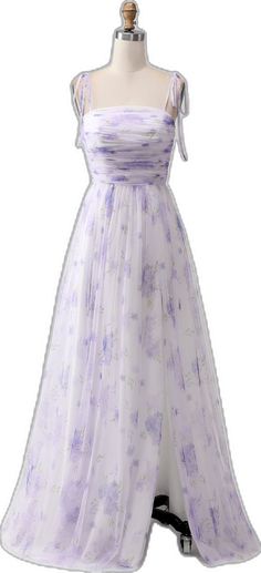 a dress on a mannequin with purple and white florals in the background