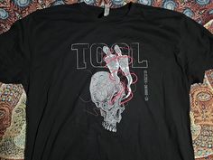 Official Tool Band shirt for the February 17th 2024 Fear Inoculum concert in Ontario California Has the city and date for the concert on the front, with additional 2023-2024 dates on the back! Shirt design is by Adam Jones, the guitarist of Tool Shirt is unworn Have size XL and XXL, please let me know which size you would like Back Shirt Design, Fear Inoculum, Tool Shirt, Ontario California, Adam Jones, Tool Band, Alex Grey, Back Shirt, The Concert