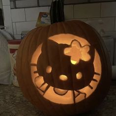 a pumpkin carved to look like a hello kitty