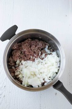 the food is being prepared in the pot on the table