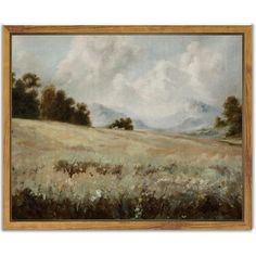 a painting of a field with trees and clouds in the background, framed on wood