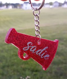 Cheer keychain, custom made to order with epoxy resin.  Please see photos for color options. If you need a color that you don't see in the photos, please message me! =) Font/numbers of your choice. * Light Weight * Durable * Waterproof * UV Resistant * Food Safe * Withstands temps up to 120oF Cheer Keychain, Font Numbers, Cheer Bag, Keychain Custom, Chain Ring, Daughter Love, Food Safe, Key Chain, Epoxy Resin