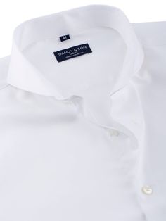 Crafted from a high-quality, 100% cotton crisp white fabric that's both delicate and soft to the touch. A non-iron, wrinkle-free finish ensures that you always look sharp and professional, no matter what your day throws at you. Our Dandyfit™ range ensures a sleek and modern silhouette, with angled barrel cuff for a touch of sophistication. Featuring our signature Extreme Cutaway Collar, complemented with mother of pearl buttons, this shirt makes a bold statement that sets you apart from the crow