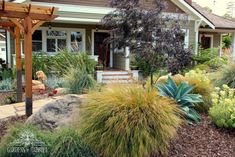 a house with landscaping in front of it