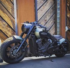 a motorcycle parked in front of a wooden building