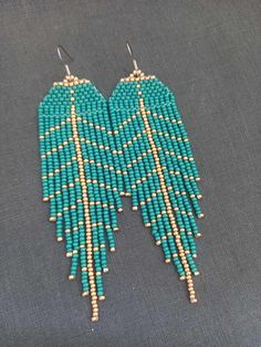 Leaf Green Gold Long Earrings Autumn Beaded Chandelier Earrings Blue Earrings Beaded Earrings Boho Earrings Beaded Earrings Fringe Earrings Earrings are 11,5 cm (4.52 inches) long with hooks and 3.5 cm (1.18 inches) wide., 100% handmade. You can find my other products in my store: https://www.etsy.com/shop/SilankaUa?ref=seller-platform-mcnav Please note that due to lighting effects, brightness, contrast and other monitor settings, there may be slight differences in the color tone/hue of the phot Autumn Beaded Earrings, Indigenous Beaded Earrings, Indigenous Crafts, Gold Long Earrings, Beaded Chandelier Earrings, Long Gold Earrings, Beaded Chandelier, Beaded Earrings Patterns, Leaf Green