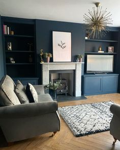 a living room with blue walls and furniture