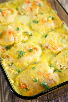 a casserole dish filled with chicken and vegetables