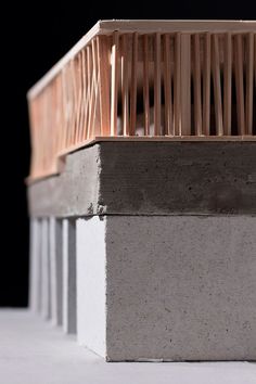 a close up view of some concrete blocks with wood slats on top and bottom