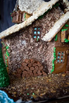 a close up of a gingerbread house with icing