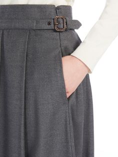 Find MAX MARA Wool Pleated Skirt on Editorialist. Long skirt in warm wool-blend flannel fabric featuring pressed pleat detail and in-seam side pockets. The unlined model boasts a flared fit, topstitched waist and a prong buckle-fastening strap at the side. Concealed zip fastening at the side. Wool Pleated Skirt, Grey Trousers, Pleated Midi Skirt, Gray Skirt, Flannel Fabric, Fall 2024, Max Mara, Long Skirt, Pleated Skirt