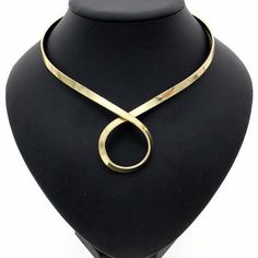 Golden Loop Torque Necklace Metal Collar Necklace, Gold Alloy Jewelry For Party, Gold Alloy Party Jewelry, Gold Alloy Choker For Parties, Gold Alloy Party Choker, Gold-tone Clavicle Chain Jewelry, Adjustable Alloy Jewelry For Formal Occasions, Gold-tone Alloy Jewelry For Party, Light Gold Metal Jewelry For Formal Occasions