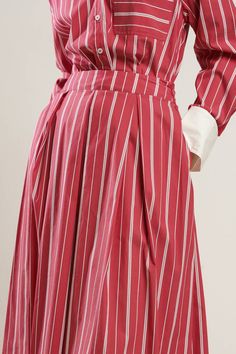 A striped woven full skirt with side zipper closure. Matching Top FT1310. Details: Self : 70% Cotton 27% Nylon 3% SpandexContrast : 100% Polyester Size & Fit - Model is 5`8" And Wearing Size Small- Measurements Taken From Size Small- Approx. Length: 33" Spring Striped Flared Skirt, Summer Workwear Skirt With Vertical Stripes, Relaxed Striped Skirt For Spring, Chic Striped Pleated Bottoms, Chic Striped Lined Skirt Bottoms, Striped Midi Skirt For Work, Chic Striped Full Skirt, Relaxed Skirt With Striped Hem, Spring Striped Pleated Skirt