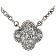 This fabulous Van Cleef & Arpels necklace from the iconic Pure Alhambra collection features the lucky clover pendant crafted in 18k white gold and set with brilliant-cut round diamonds. Completed with an adjustable length chain. Made in France circa 2010s. Measurements: 0.43" (11mm) width, 16.5" (41.9cm) length. Excellent condition. Comes with original box and service receipt. Van Cleef Arpels Necklace, Van Cleef Arpels Diamond, Gold Vans, White Gold Pendant Necklace, Van Cleef & Arpels, Clover Pendant, Lucky Clover, Long Pendant Necklace, Modern Necklaces