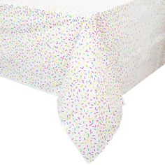 a white table cloth with multicolored confetti on the top and bottom