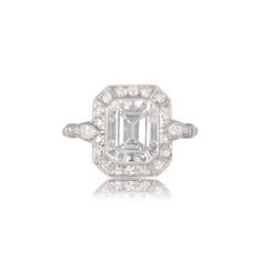 This is a GIA certified engagement ring that features a 2.60ct emerald cut diamond center. The diamond is decorated with a row of old cut diamonds around its center and two pear-shaped diamonds on the shoulders. ✦DIAMOND SPECIFICATIONS: Center Diamond Size: 2.60-Carats Diamond Color: H Color Diamond Clarity: VS2 Clarity Diamond-Cut: Emerald Cut ✦ ENGAGEMENT RING SPECIFICATIONS: Style: Vintage Ring Material: Platinum Certification: GIA ✦ WHAT COMES IN YOUR SHIPMENT: - Your Engagement Ring - Quali Gia Certified Asscher Cut Diamond Ring, Gia Certified Emerald Cut Platinum Cluster Ring, Gia Certified Emerald Cut Cluster Promise Ring, Gia Certified White Gold Octagon Emerald Ring, Gia Certified Emerald-cut Platinum Cluster Ring, Gia Certified Octagon Emerald Ring In White Gold, Elegant Gia Certified Square Cut Diamond Ring, Gia Certified Elegant Square Cut Diamond Ring, Gia Certified Platinum Emerald Cut Rings