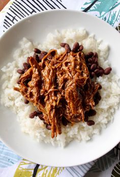 a white plate topped with rice and beans