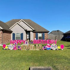 a happy birthday sign in front of a house