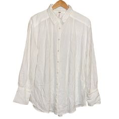 Free Peoplenwt Linen/Rayon Blend Long Sleeve Flowy Oversized White Button Up Blouse Size Small. Excellent Nwt Condition. Flowy Oversized Bodice. Has 2-Sidw Slits, Full Button Up, With Collar. Can Be Woen Opened Un Buttoned Or Buttoned. Perfect For Nightly Walks On The Beach Or A Swim Cover Up. Also Can Be Worn Out On Casual Occasions. Vert Versatile. ***Reasonable Offers Are Definitely Welcome And Will Be Considered Happy Poshing*** Colors May Vary From Different Viewing Devices. Materials: 51% Relaxed Fit Daywear Blouse With Buttons, Daywear Blouse With Buttons And Relaxed Fit, Oversized Linen Blouse With Button Closure, Oversized Button-up Blouse With Buttons, Oversized White Blouse With Placket, White Linen Button-up Blouse, White Button-up Blouse With Back Button Closure, Oversized White Blouse With Button Closure, Casual White Top With Covered Buttons